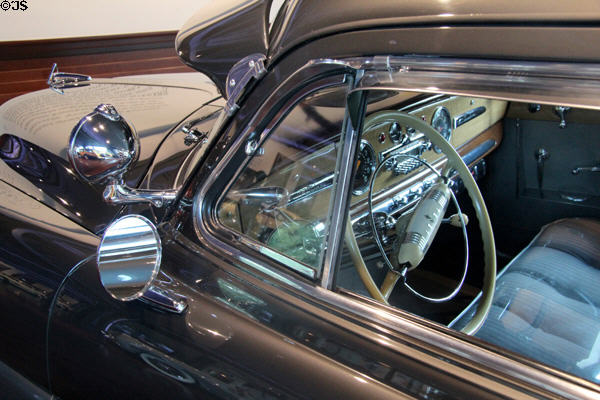 External spotlight & steering wheel of Hudson Commodore Sedan (1948) at Audrain Automobile Museum. Newport, RI.