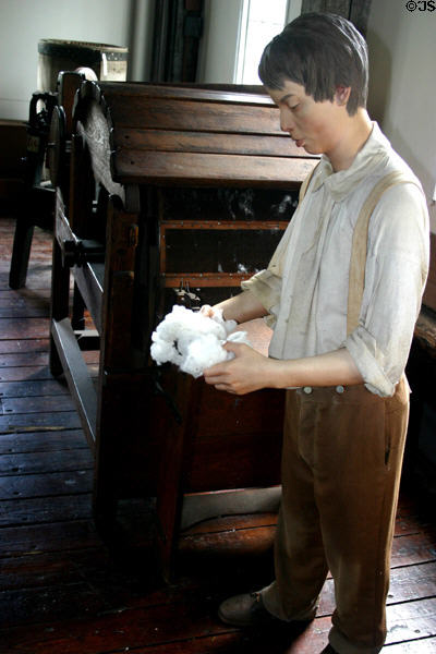 Mannequin reminds Slater Mill visitors that running a cotton carding machine (replica c1790) was dangerous child labor. Pawtucket, RI.