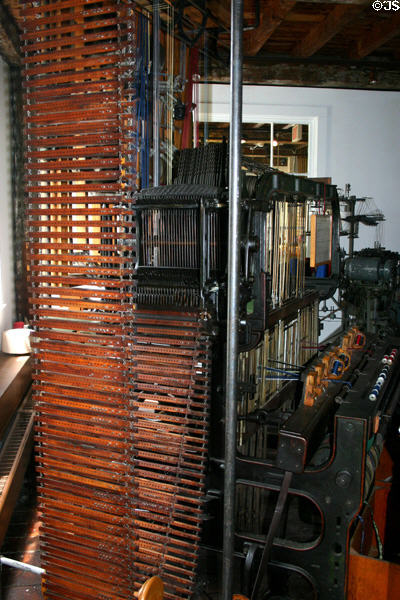 Jacquard loom where wooden punch cards programmed pattern to be woven. Pawtucket, RI.