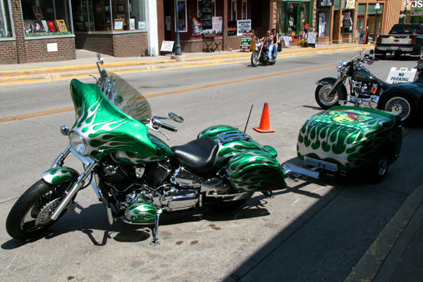 Green painted Yamaha motorcycle with matching trailer. Lead, SD.