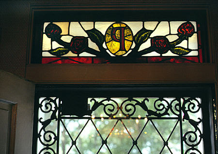 Stained glass initial in transom of Elvis' Graceland. Memphis, TN.