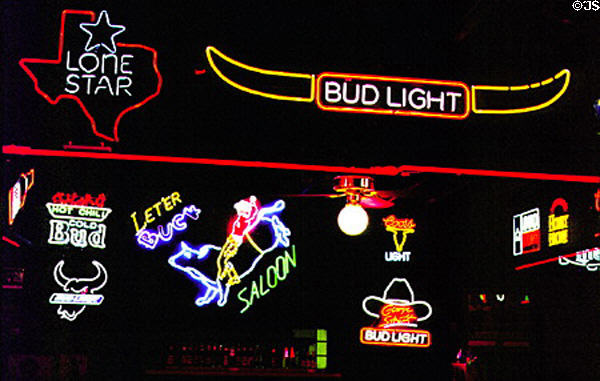 Lighted neon signs in Billy Bob's Texas Bar in Stockyards National Historic District. Fort Worth, TX.