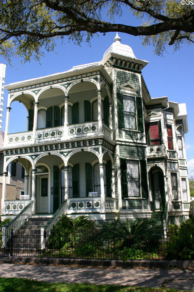 Victorian arcaded house (1887) (1808 Postoffice) with green tower. Galveston, TX.