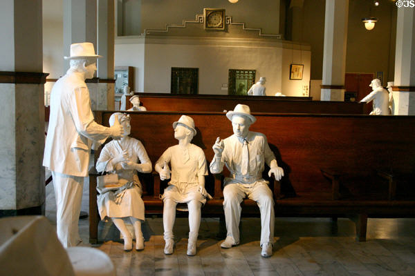 Old Santa Fe depot recreation of waiting room in Railroad Museum with Ghosts of Travelers Past by sculptors Irvan & Elliot Schwartze. Galveston, TX.