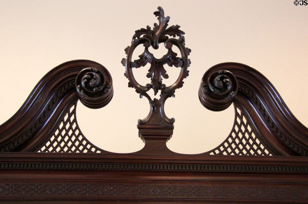 Detail of open swans-neck pediment & finial of High Chest of Drawers (1760-1800) from Philadelphia at Bayou Bend. Houston, TX.