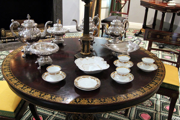Early American (early 19thC) silver tea & coffee service by Samuel Kirk of Baltimore & porcelain tea service by William Ellis Tucker of Philadelphia in Chillman Parlor at Bayou Bend. Houston, TX.