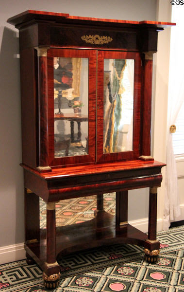 Early American (early 19thC) mirrored cabinet on mirrored table base in Chillman Parlor at Bayou Bend. Houston, TX.