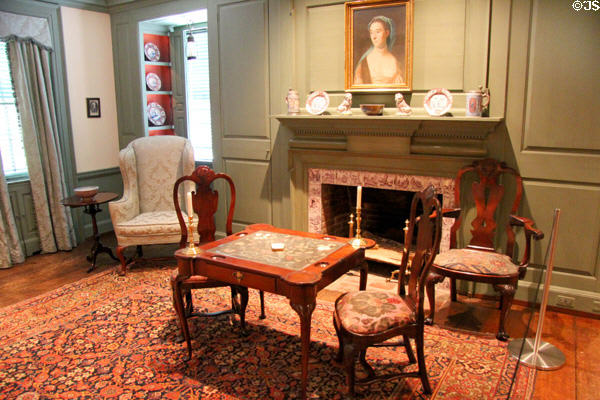 Card table with embroidered top & fireplace (18th C) with portrait by John Singleton Copley in Queen Anne Suite at Bayou Bend. Houston, TX.