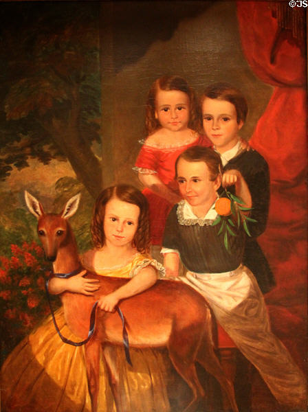 Portrait of four children with deer at Bayou Bend. Houston, TX.