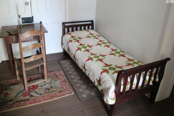 Bedroom with quilt at Kellum-Noble House at Sam Houston Park. Houston, TX.