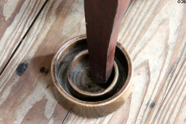 Ceramic water trap against insects under kitchen table leg at Nichols-Rice-Cherry House at Sam Houston Park. Houston, TX.
