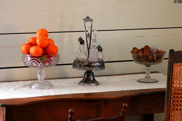 Glass footed-fruit stands & cruet set in San Felipe Cottage at Sam Houston Park. Houston, TX.