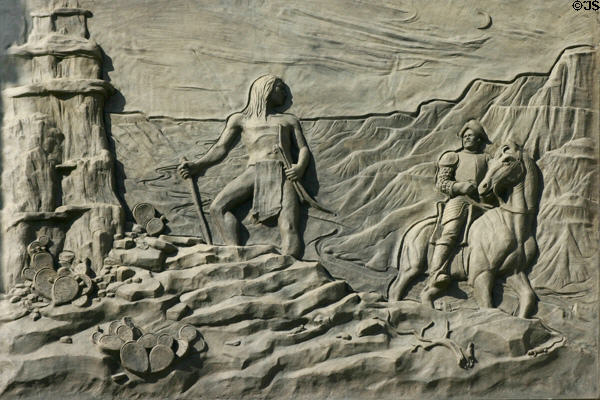 Sculpted history panel of Spaniards meeting Indians by Michael O'Brien on Texas State History Museum. Austin, TX.