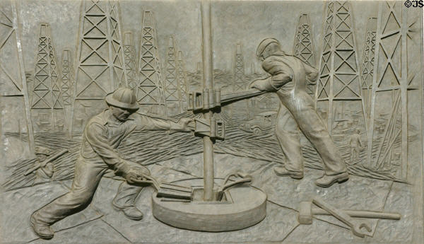 Sculpted history panel of drilling for oil by Michael O'Brien on Texas State History Museum. Austin, TX.
