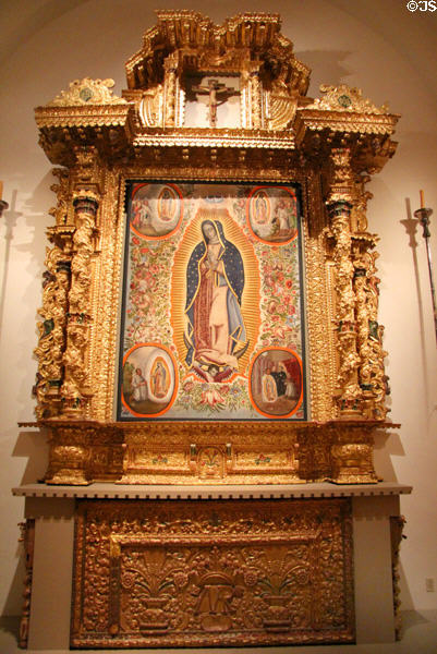 Virgin of Guadalupe from Mexico on altar screen from Bolivia (both 18thC) at San Antonio Museum of Art. San Antonio, TX.