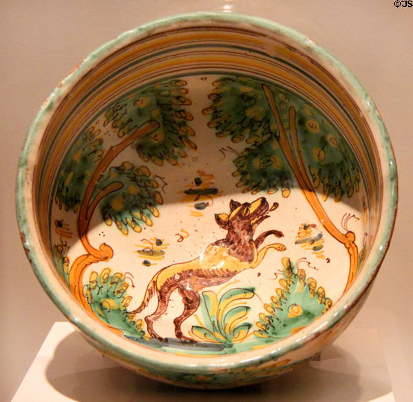Earthenware bowl painted with jumping canine (late 17thC) from Spain at San Antonio Museum of Art. San Antonio, TX.