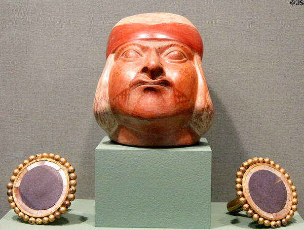 Mochica culture earthenware portrait vessel (c600) & pair of earspools (c300) from Northern Peru at San Antonio Museum of Art. San Antonio, TX.