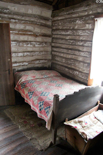 Bed & cradle in Walton-Smith log cabin at Pioneer Museum. Fredericksburg, TX.