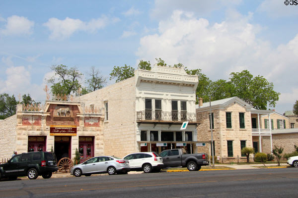 White Elephant Saloon (1888) with other heritage commercial buildings (242-254 East Main St.). Fredericksburg, TX.