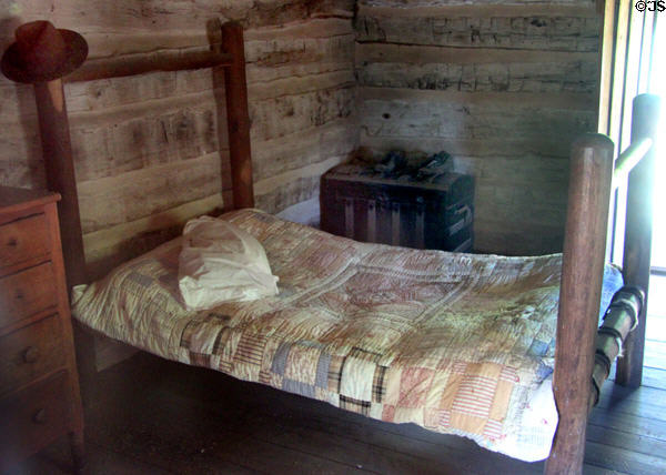 Bed in Sam Ealy Johnson log house. Johnson City, TX.