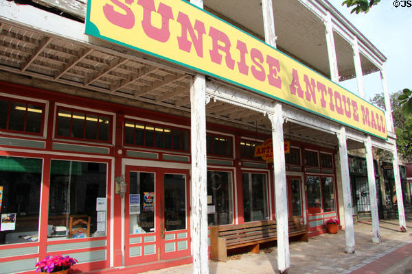 Former Fawcett Furniture building (1907) (now Antique mall) with sidewalk arcade (820 Water St.). Kerrville, TX.