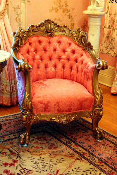 Louis XV style armchair (Robert Mitchell Furniture Co., Cincinnati OH) with gilt carving in pink parlor at McFaddin-Ward House. Beaumont, TX.
