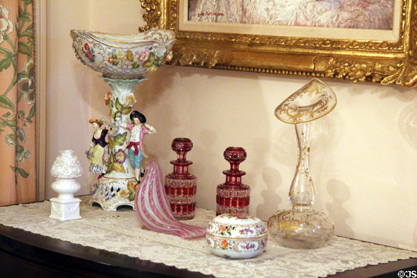 Glass & porcelain decorative objects in pink bedroom at McFaddin-Ward House. Beaumont, TX.