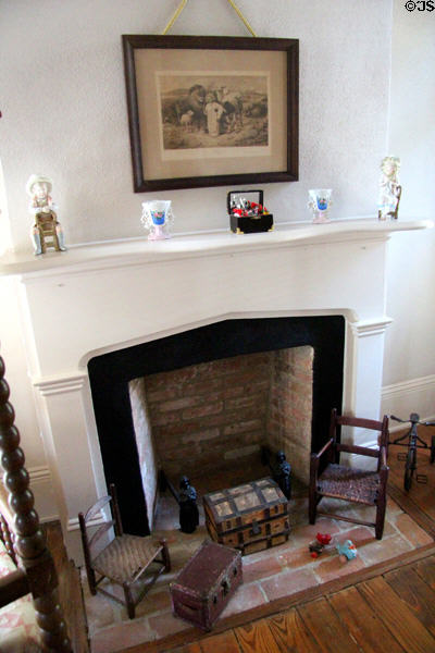 Fireplace with toys at East Terrace House. Waco, TX.