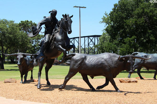 Vaquero drives longhorns in Chisholm Trail sculpture (2008) by Robert Summers. Waco, TX.