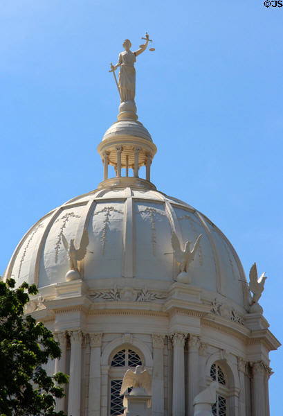 Dome details of McLennan County Courthouse with statue of justice & eagles. Waco, TX.