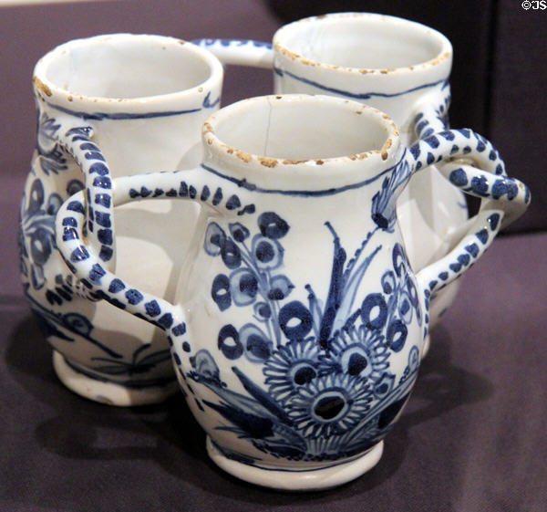 Earthenware fuddling cup (puzzle cup to drink from three cups without spilling) (c1650-1700) from England at Dallas Museum of Art. Dallas, TX.