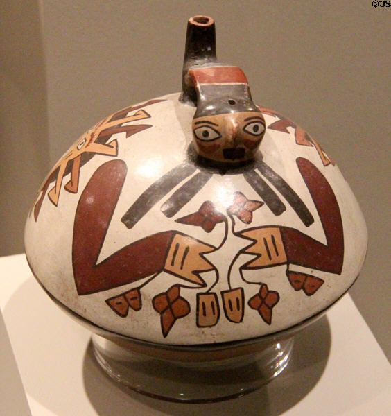 Ceramic Nazca-culture single-spout strap-handle vessel of swimmer holding plants (350-450) from south coast, Peru at Dallas Museum of Art. Dallas, TX.