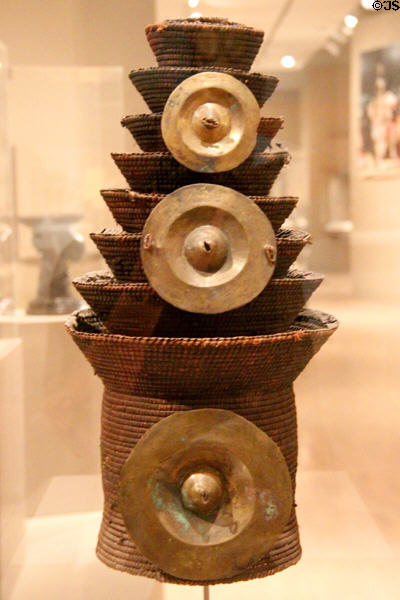 Tiered hat with brass disks (20thC) by Mongo culture from Zaire at Dallas Museum of Art. Dallas, TX.