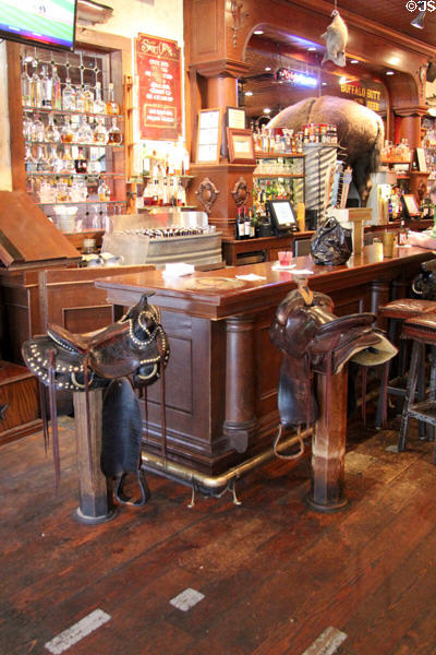 Bar with saddle stools at Stockyards Hotel in Thannisch Block Building. Fort Worth, TX.