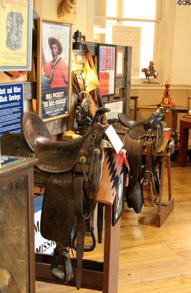 Saddles & cowboy display at Stockyards Museum. Fort Worth, TX.