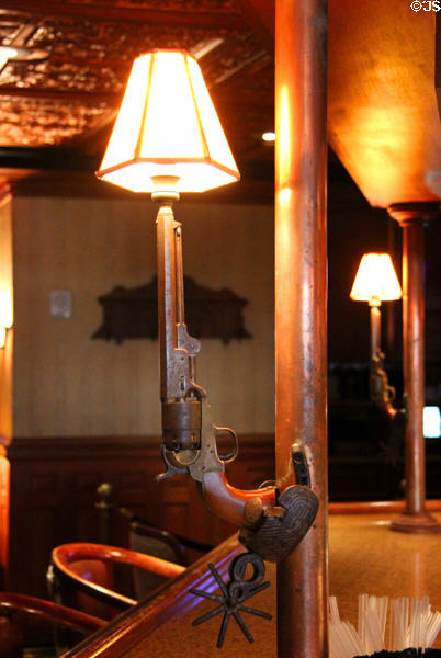 Sixshooter converted to a bar lamp at Driskill Hotel. Austin, TX.