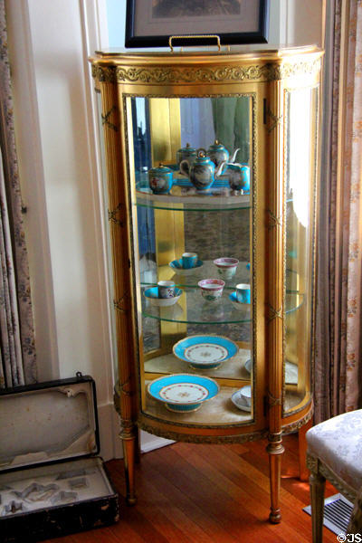Vitrine with blue Sevres porcelain at Neill-Cochran House Museum. Austin, TX.