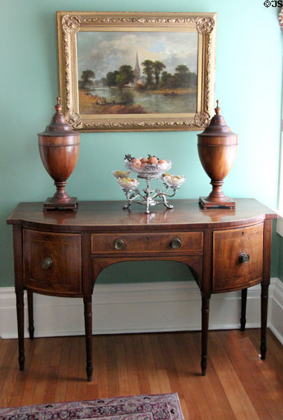 Curve-front sideboard with knife containers & silver fruit basket at Neill-Cochran House Museum. Austin, TX.