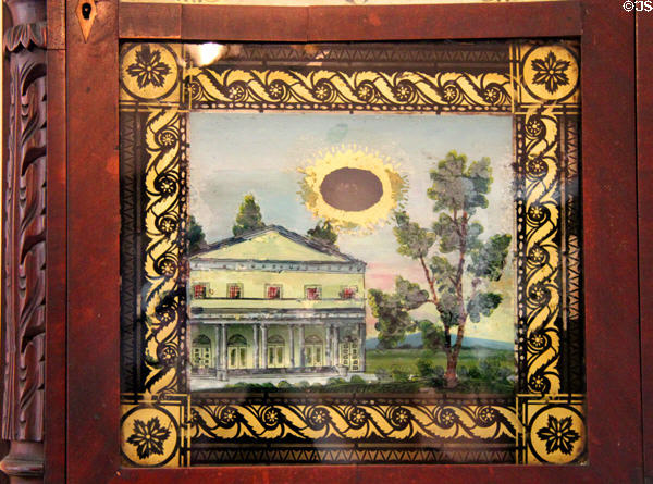 Painted glass panel of mantle clock at Neill-Cochran House Museum. Austin, TX.