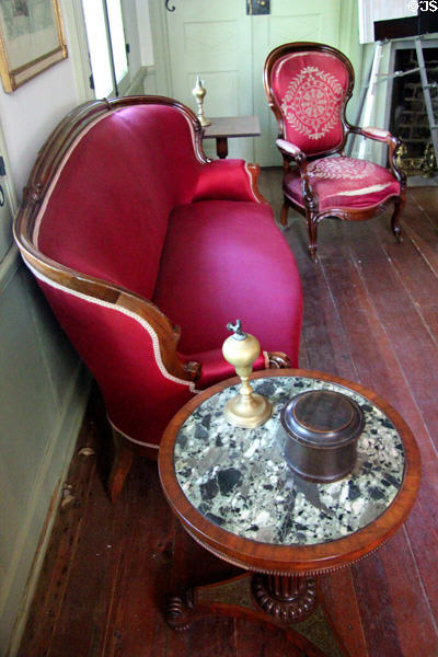 Setee, armchair & round table in parlor at French Legation Museum. Austin, TX.