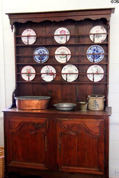 Sideboard with plates at in kitchen French Legation Museum. Austin, TX.