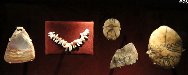 Excavated native painted pebbles, beads & pendants (c2000-1500 BCE) (lent: U/TX Austin) at Bullock Texas State History Museum. Austin, TX.