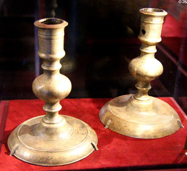 Brass candlesticks (c1684) excavated from La Belle Shipwreck (lent: TX Historical Commission) at Bullock Texas State History Museum. Austin, TX.