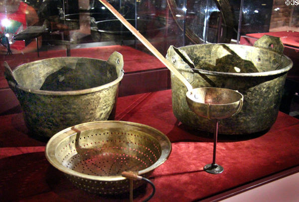 Brass cooking pots, ladle & colander (c1684) excavated from La Belle Shipwreck (lent: TX Historical Commission) at Bullock Texas State History Museum. Austin, TX.