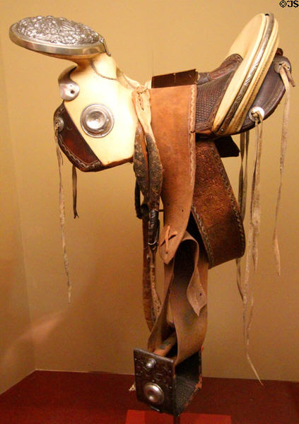 Charro saddle (c1860s) with one stirrup said to have belonged to Santa Anna who lost his leg during US-Mexican War (lent: U/TX Austin) at Bullock Texas State History Museum. Austin, TX.