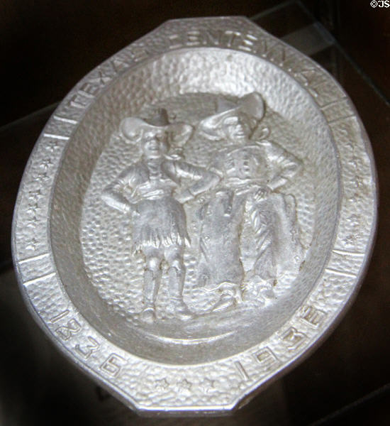 Texas Centennial commemorative metal ashtray with cowgirl & cowboy (1936) at Gonzales Historical Memorial. Gonzales, TX.