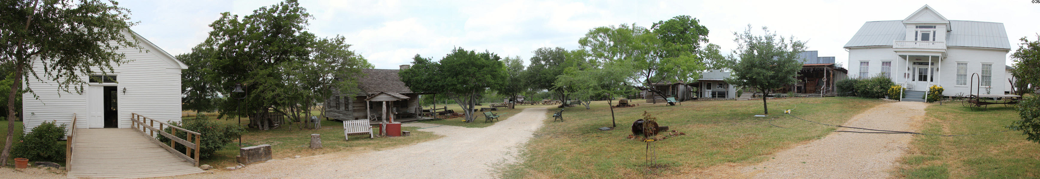 Panorama of Gonzales Pioneer Village Living History Center, a collection of 1800s structures. Gonzales, TX.