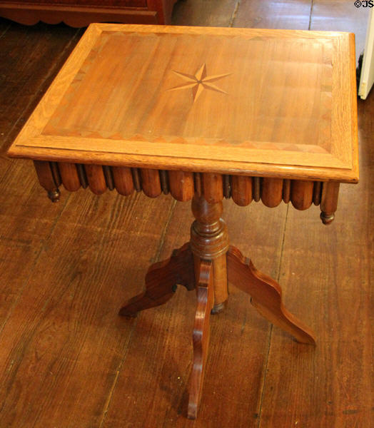 Side table with inlaid star & center pedestal at Museum of Texas Handmade Furniture. New Braunfels, TX.