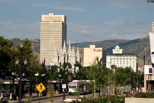 Skyline of Mormon Temple Square with LDS Office Building, beehive dome of Joseph Smith Memorial Building all over streetcar on South Temple Street. Salt Lake City, UT.