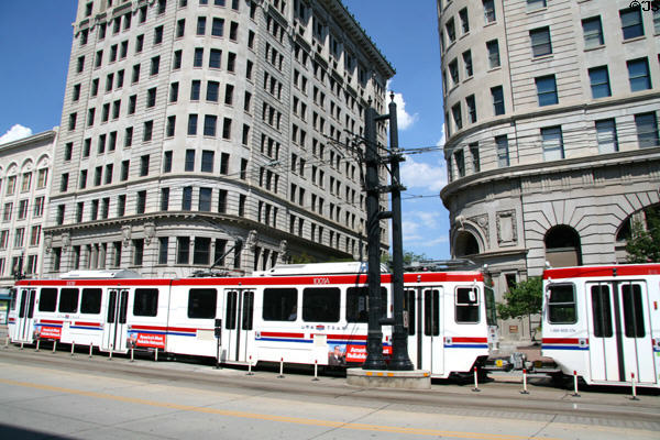 UTA Trax streetcars run in front of Boston & Newhouse Buildings. Salt Lake City, UT.